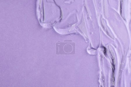 Photo for Clear cosmetic gel on violet background, top view. Space for text - Royalty Free Image