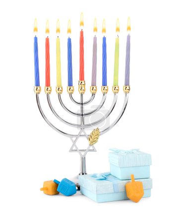 Hanukkah celebration. Menorah with candles, gift boxes and colorful dreidels isolated on white-stock-photo