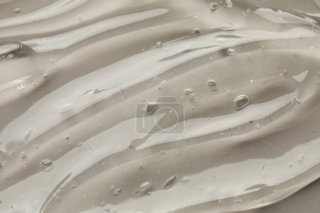 Photo for Clear cosmetic gel on grey background, closeup - Royalty Free Image