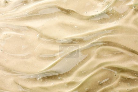 Photo for Clear cosmetic gel on beige background, top view - Royalty Free Image