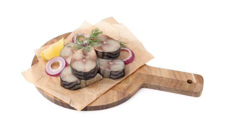 Slices of tasty salted mackerel with lemon and onion isolated on white