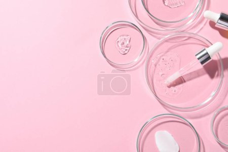 Photo for Pipette, cosmetic serum and petri dishes with samples on pink background, flat lay. Space for text - Royalty Free Image
