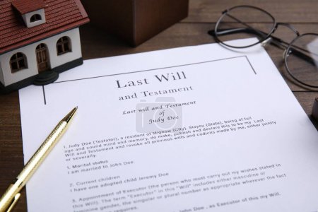 Photo for Last will and testament near house model, glasses with pen on table, closeup - Royalty Free Image