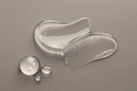 Photo for Sample of clear cosmetic gel on grey background, top view - Royalty Free Image