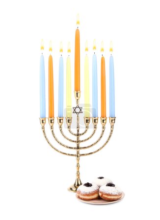 Hanukkah celebration. Menorah with candles and donuts isolated on white
