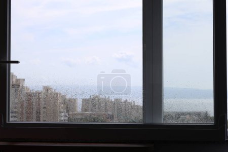 Photo for Window with water drops on rainy day - Royalty Free Image