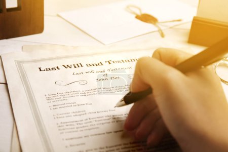 Woman reading Last Will and Testament at table, closeup