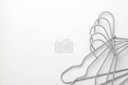 Photo for Hangers on white background, top view. Space for text - Royalty Free Image