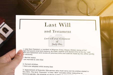 Woman holding Last Will and Testament at table, top view