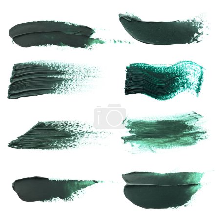 Dark green oil paint strokes isolated on white, top view