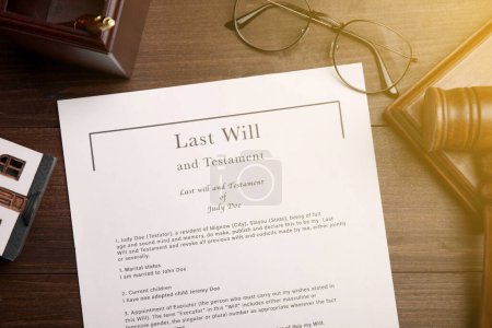 Last Will and Testament, glasses and gavel on wooden table, flat lay