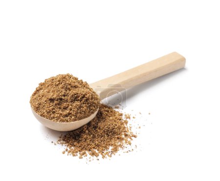 Wooden spoon of aromatic caraway (Persian cumin) powder isolated on white