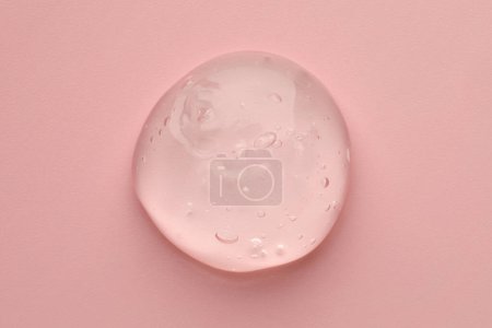 Photo for Sample of clear cosmetic gel on pink background, top view - Royalty Free Image