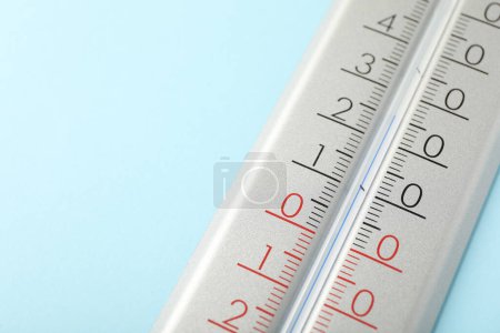Photo for Weather thermometer on light blue background, closeup. Space for text - Royalty Free Image
