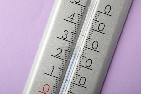 Photo for Modern weather thermometer on lilac background, closeup - Royalty Free Image