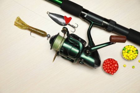 Photo for Fishing tackle on wooden background, flat lay. Space for text - Royalty Free Image