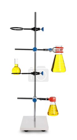 Retort stand with flasks of yellow liquid isolated on white