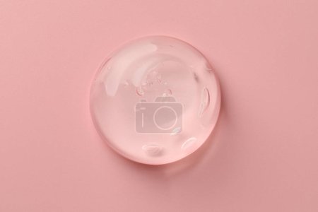 Photo for Sample of clear cosmetic gel on pink background, top view - Royalty Free Image