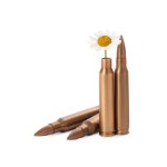 Bullets and cartridge case with beautiful flowers isolated on white