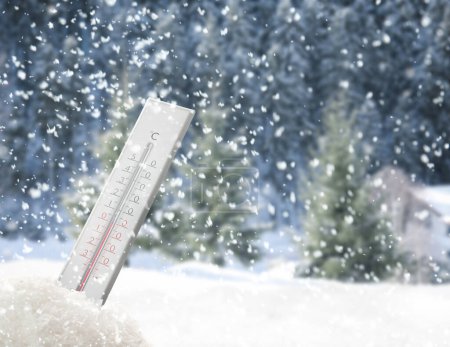 Photo for Weather thermometer under falling snow outdoors on winter day, space for text - Royalty Free Image