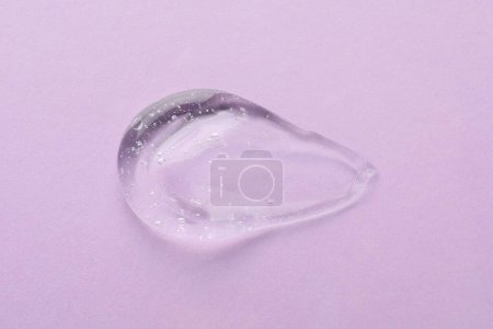 Photo for Clear cosmetic gel on light violet background, top view - Royalty Free Image