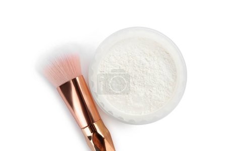 Rice loose face powder and makeup brush on white background, top view.