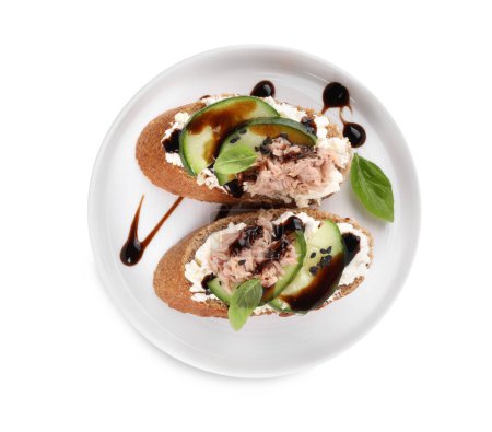 Delicious bruschettas with balsamic vinegar and toppings isolated on white, top view