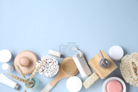 Photo for Bath accessories. Flat lay composition with personal care products on light blue background, space for text - Royalty Free Image