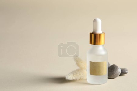 Photo for Composition with bottle of cosmetic serum on beige background. Space for text - Royalty Free Image