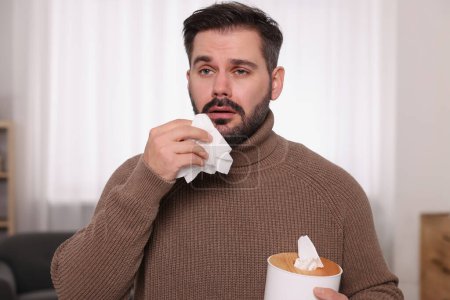 Photo for Sick man with tissues at home. Cold symptoms - Royalty Free Image