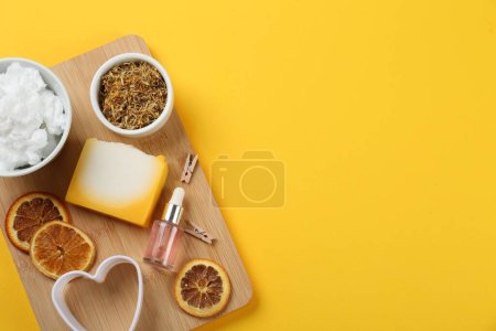 Photo for Flat lay composition with natural handmade soap and ingredients on yellow background. Space for text - Royalty Free Image