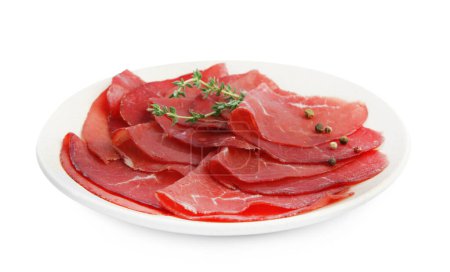 Photo for Slices of tasty bresaola and thyme isolated on white - Royalty Free Image