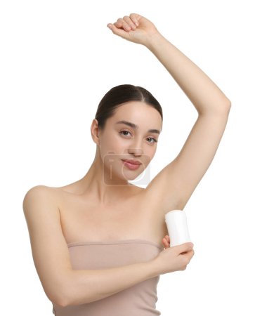Beautiful woman applying deodorant on white background