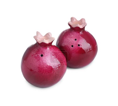 Pomegranate shaped salt and pepper shakers isolated on white