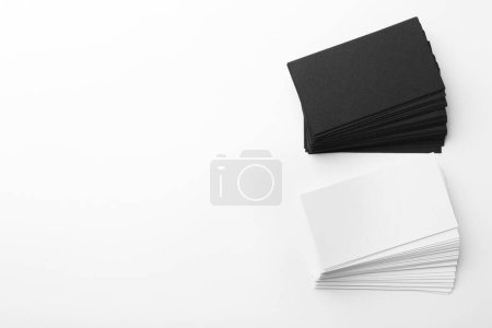 Photo for Blank business cards on white background, flat lay. Mockup for design - Royalty Free Image