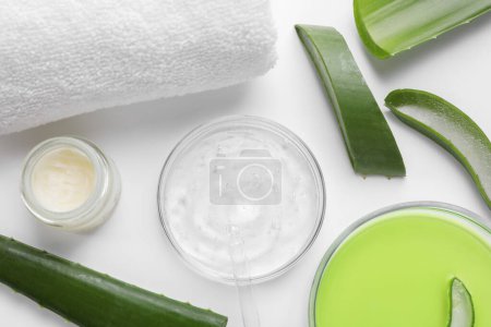Photo for Flat lay composition with cosmetic products and cut aloe leaves on white background - Royalty Free Image