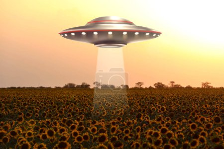 Alien spaceship emitting light in air over sunflower field. UFO