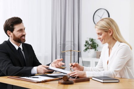 Photo for Woman having meeting with lawyer in office - Royalty Free Image