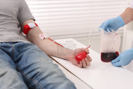 Patient undergoing blood transfusion in hospital, closeup