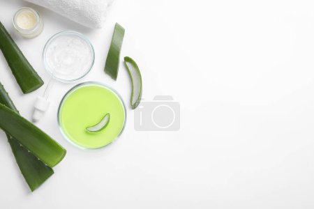 Photo for Flat lay composition with cosmetic products and cut aloe leaves on white background. Space for text - Royalty Free Image