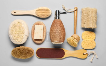 Bath accessories. Flat lay composition with personal care tools on light grey background