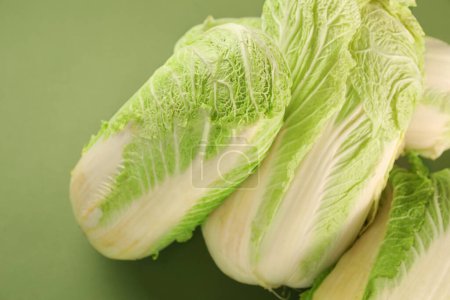 Fresh ripe Chinese cabbages on olive background, closeup