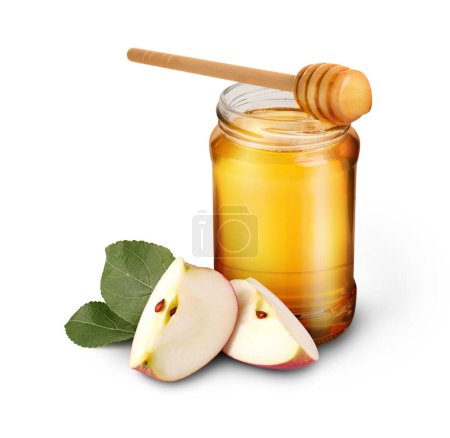 Téléchargez les photos : Miel dans un bocal en verre, pomme coupée et trempette isolée sur blanc - en image libre de droit