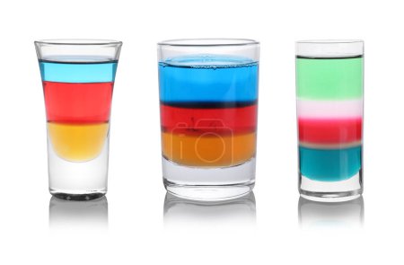 Different shooters in shot glasses isolated on white, set