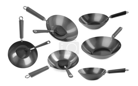 Empty metal woks isolated on white, set
