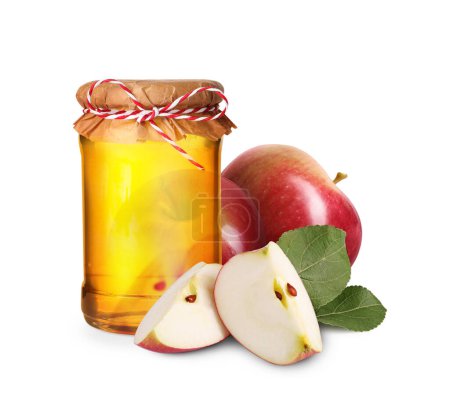 Téléchargez les photos : Miel dans un bocal en verre et pommes isolé sur blanc - en image libre de droit