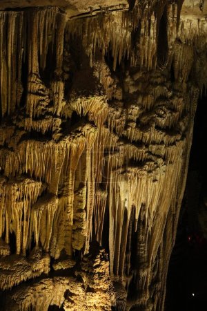 Picturesque view of many stalactite formations in cave