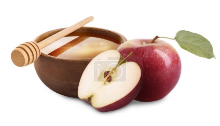 Téléchargez les photos : Miel dans un bol et pommes isolé sur blanc - en image libre de droit