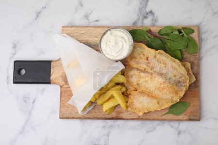 Photo for Delicious fish and chips with tasty sauce and mangold on white marble table, top view - Royalty Free Image