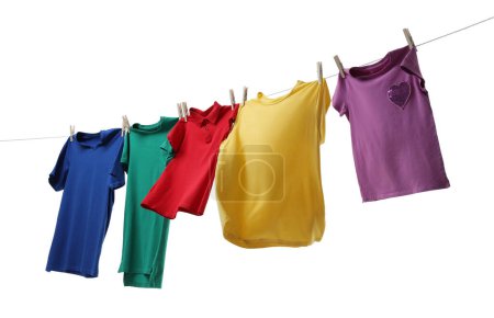 Photo for Colorful t-shirts drying on washing line isolated on white - Royalty Free Image